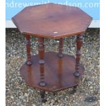 An Edwardian octagonal two tier occasional table