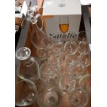 Large collection of champagne flutes and other glasses