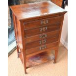 An Edwardian mahogany music cabinet