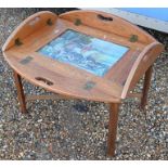 A vintage tile inset butlers tray coffee table