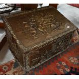 A pressed brass coal box