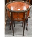 A French Louis XV style kingwood veneered oval table