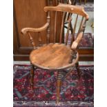 A Victorian stained beech spindle back captain's chair