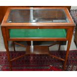 An Edwardian walnut framed vitrine