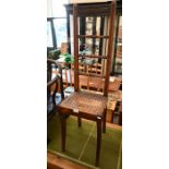 A Victorian mahogany spindle back correction chair with cane seat