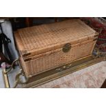 An Oriental wicker and brass bound blanket chest