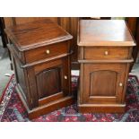 A pair of stained hardwood bedside cabinets