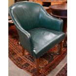 A walnut framed tub chair with studded teal leather upholstery