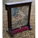 A Continental rosewood and needle work fire screen