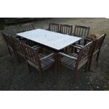 Large teak garden table and ten chairs