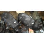 A pair of cast lead sleeping pigs