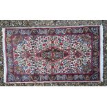 A Persian cream ground Kerman rug
