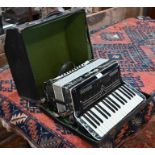 A Lorenzo green-marbled piano accordion with 24 pegs