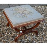 A 19th century walnut framed stool with floral tapestry seat
