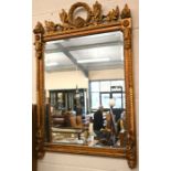 A floral and foliate gilt framed mirror
