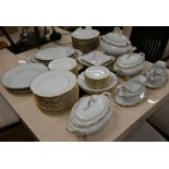 A German porcelain dinner service for twelve with gilt rims