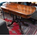 A late Victorian card table, walnut with stained pine baize lined folding top