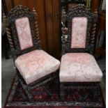 A pair of 19th century Carolean style carved oak side chairs