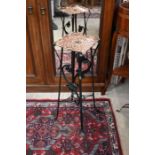 An Art Nouveau copper and cast iron plant stand