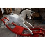 A Victorian painted wood rocking horse