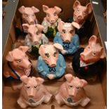 Two families of five Wade NatWest pigs