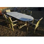 A teak garden dining table and six chairs