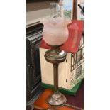 Copper oil-lamp with moulded pink glass shade
