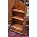 A small reproduction mahogany waterfall bookcase