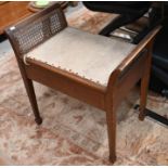 An Edwardian box seated piano stool