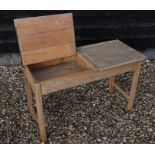 A vintage light oak double school desk