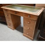 A pine twin pedestal desk