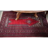 A Persian red ground rug