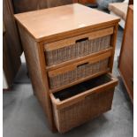 A stained teak a wicker three drawer chest