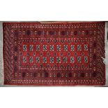 Teke Bukhara red ground rug with repeating gul design