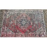 Two red ground Persian rugs (2)