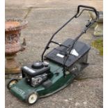 A Hayter Harrier Ltd Briggs & Stratton 4 litre petrol lawn mower to/w manual