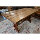 A provincial elm refectory style dining table