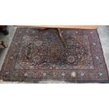 An old worn Persian Kashan rug