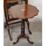 A scalloped oak occasional table