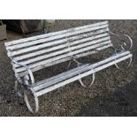 An old wrought steel and wooden slat garden bench for renovation