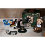 Child's sewing machine and clockwork toys
