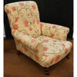 A floral upholstered armchair