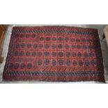 A Persian Hatchi Belouch rug