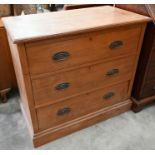 An Edwardian satin birch chest of three long drawers