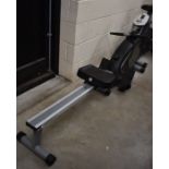 A 'Roger Black' rowing machine (folds for storage)