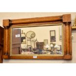 An antique rectangular wall mirror in maple frame