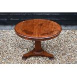 A 19th century mahogany breakfast table