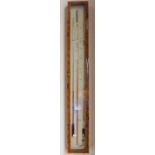 A modern walnut veneered and glazed barometer