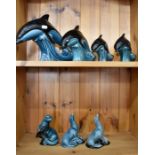 Poole pottery dolphins and sea lions