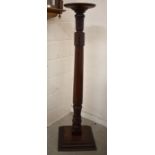 A large mahogany jardiniere stand